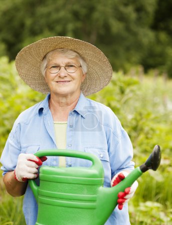 Woman holding watering can