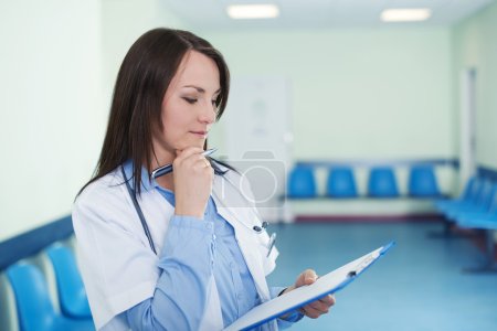 Female doctor checking medical results