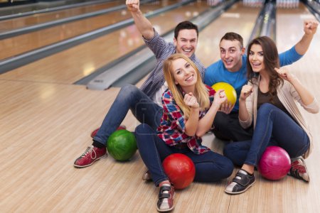 Group of friends in bowling alley