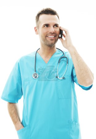Male surgeon talking on a mobile phone