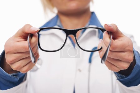 Optometrist giving new glasses