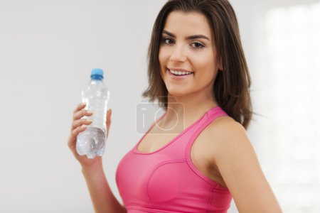 Fitness woman with water bottle