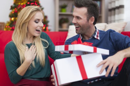 Man gives present to woman