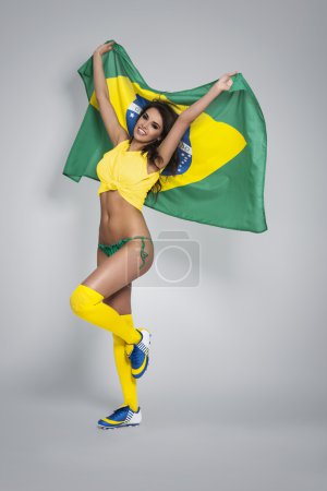 Woman holding Brazil flag