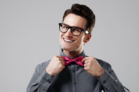 Smiling man with pink bow tie
