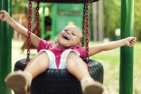 Happy girl having fun on playground