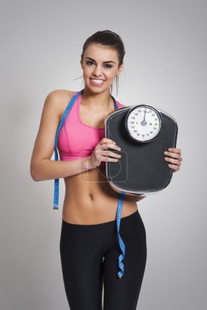 Woman with weight scale