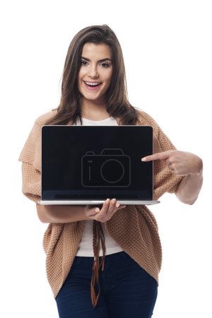 Woman showing on  laptop screen
