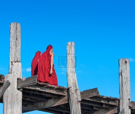 Monks crossing the river