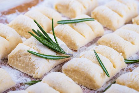 Cheese gnocchi with peas and rosemary