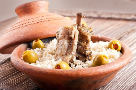 Moroccan tagine with lamb ribs, couscous and olives
