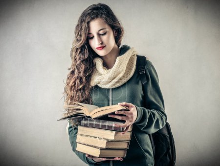 Young student holding some books