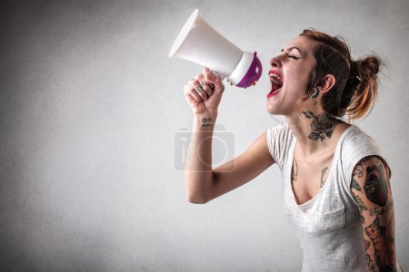 Alternative woman speaking through a megaphone