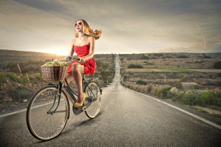 Beautiful woman riding a bike