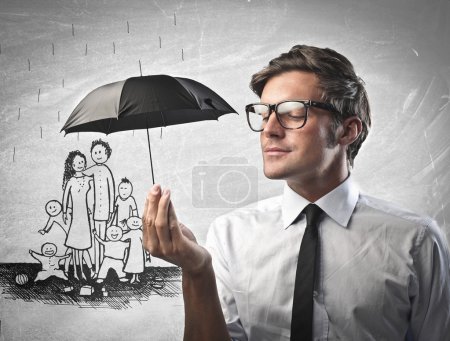 Businessman holding an umbrella
