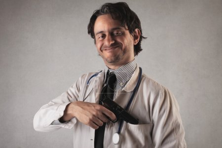 Smiling doctor with a gun