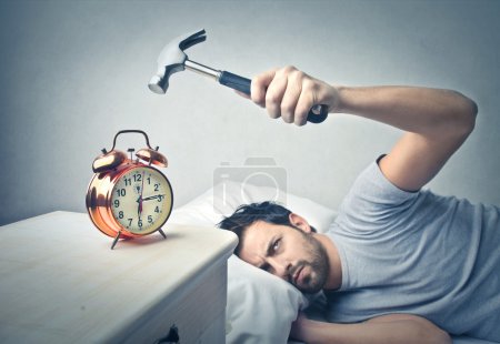 Man about to crash the alarm clock