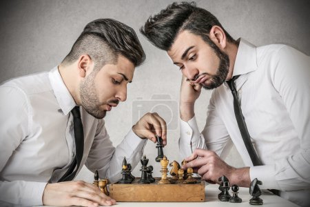 Businessmen playing chess