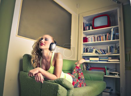 Young woman listening to the music