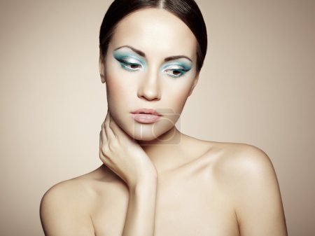 Beautiful young woman with bright make-up