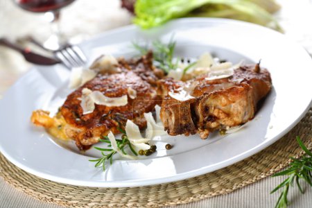 Pork chops with rosemary sauce and red wine
