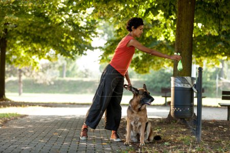 Keep clean the ambient by throwing away the dogs poo
