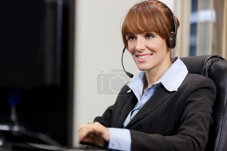 Female support assistant working at the helpdesk