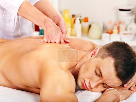 Man getting massage in spa.
