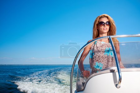Girl driving a motor boat