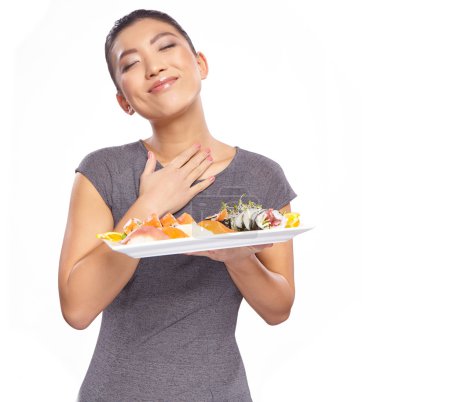Woman holding a plate with sushi