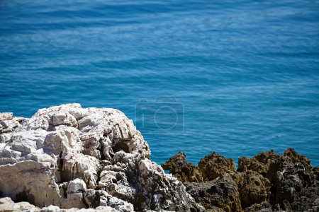 Rocks , sea and blue water background