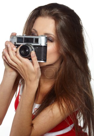 Young and beautiful woman with retro camera