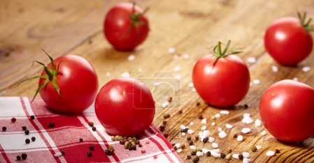 Tomatoes lying on old table