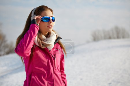 Happy smiling woman in ski goggles