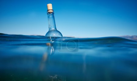Bottle with a message in water