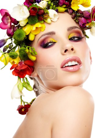 Woman with hairstyle and freesia flower. Isolated.