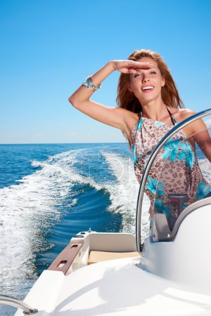 Girl driving a motor boat