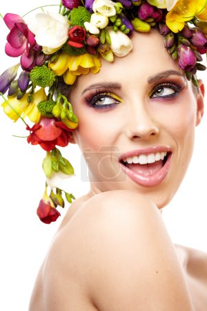 Woman with hairstyle and freesia flower. Isolated.