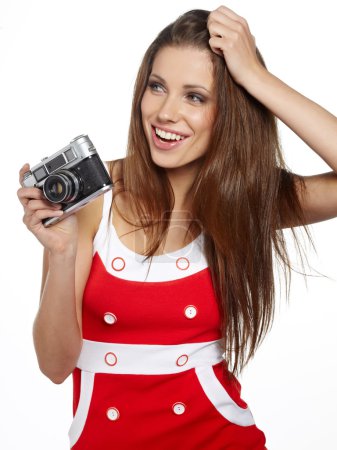 Young and beautiful woman with retro camera