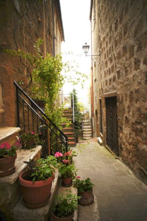 Narrow Alley With Old Buildings In Typical Italian Medieval Town