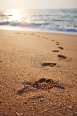 Footprints on the beach sand
