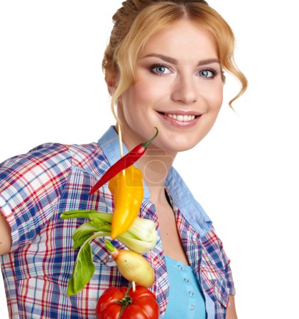 Woman holding vegetable skewers