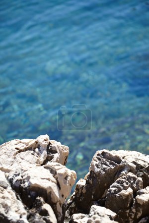 Rocks , sea and blue water background