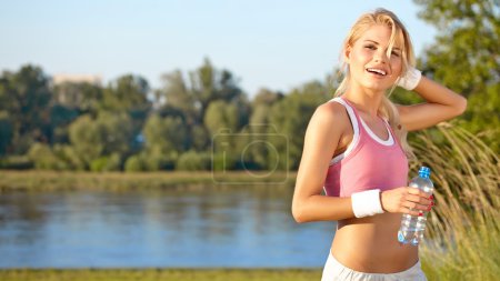 Fit woman in nature in spring