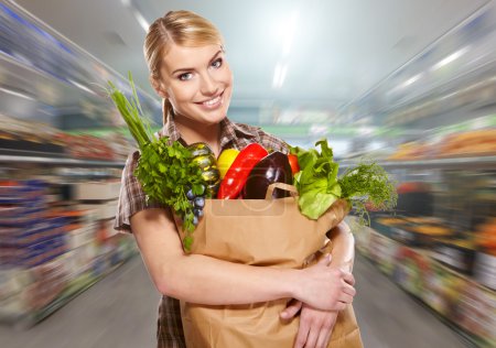 Woman shopping for fruits and vegetables