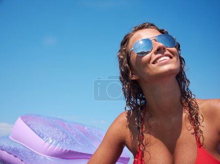 Woman on an air mattress in the sea
