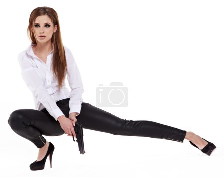 Sexy girl holding a black gun