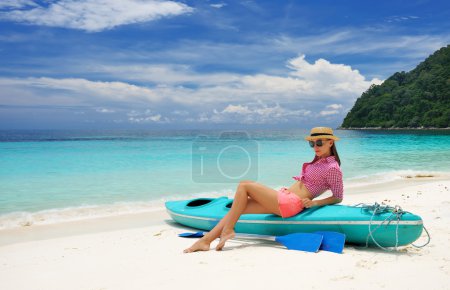 Woman in sunglasses at beach