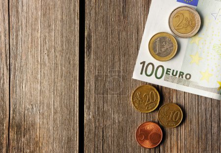 Euro money over wooden background