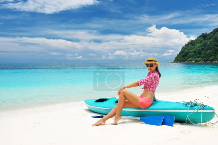 Woman in sunglasses at beach